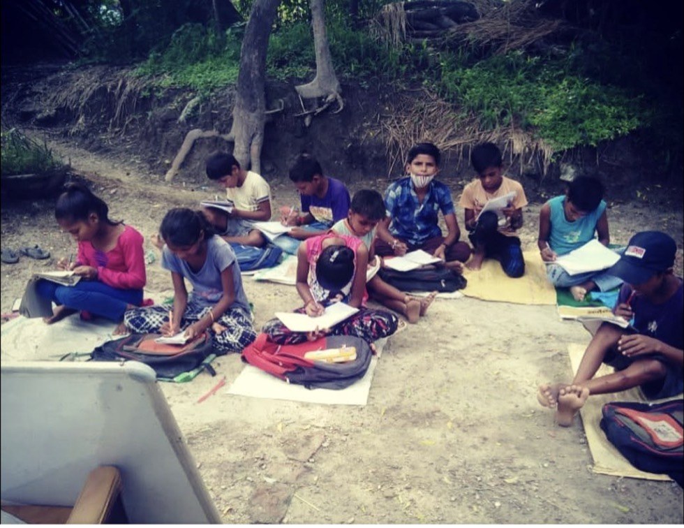 An outdoor lesson under a tree