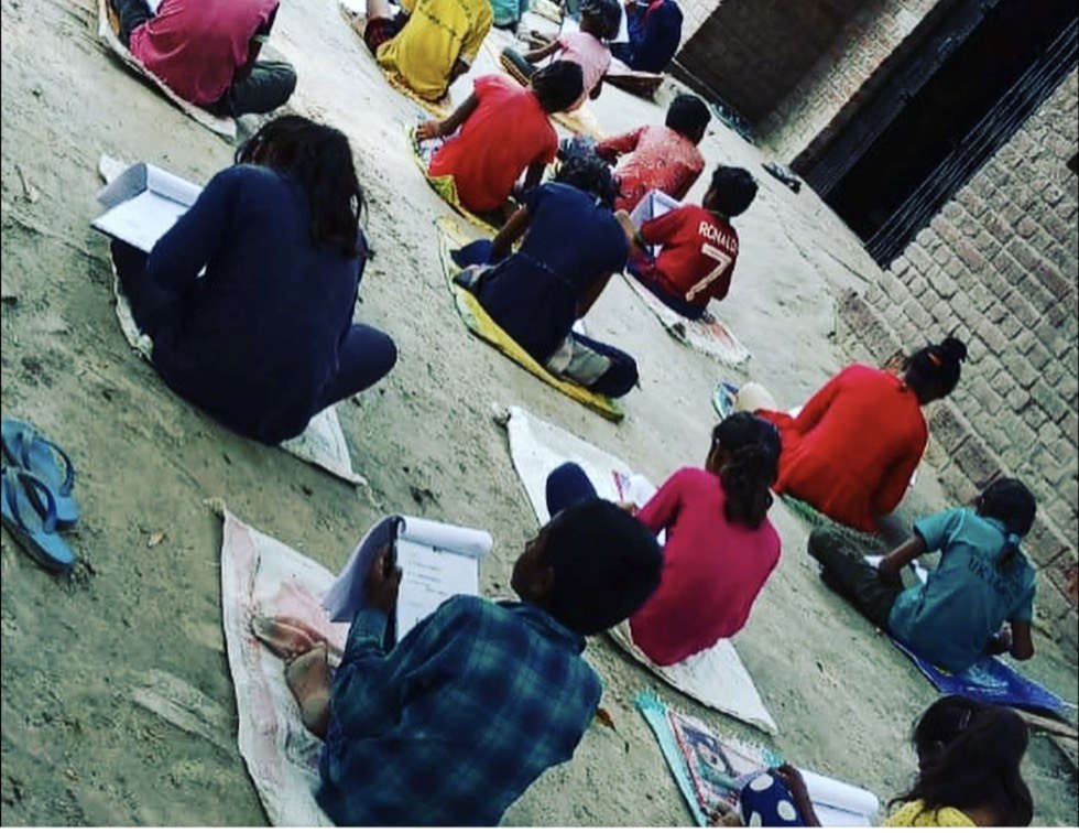Class in session, mats laid out in a courtyard